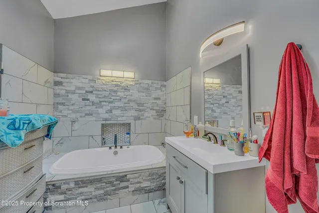 a bathroom with a sink and a bathtub