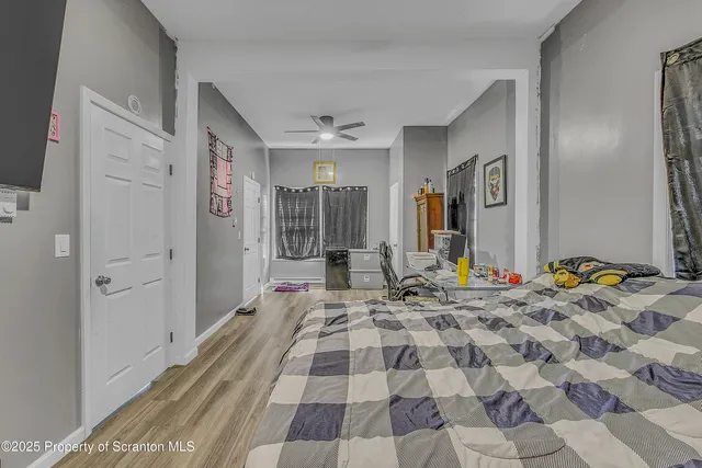 a bedroom with a bed and a mirror