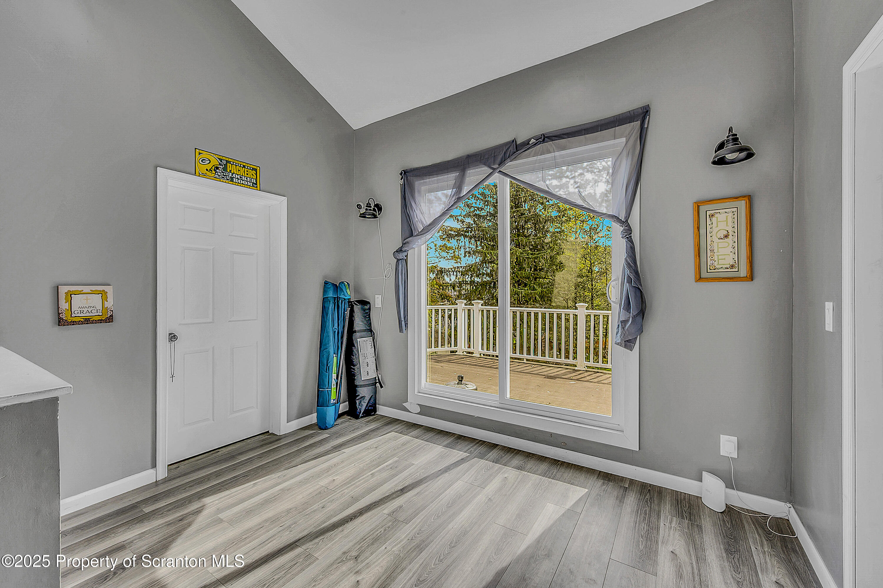 37 Mount Pocono Court Mount Pocono, PA 18344 - Photo 35 of 39 a view of an empty room with wooden floor and a window