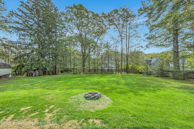 a backyard of a house with lots of green space