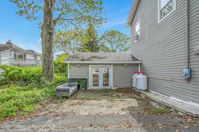 a backyard of a house with seating space