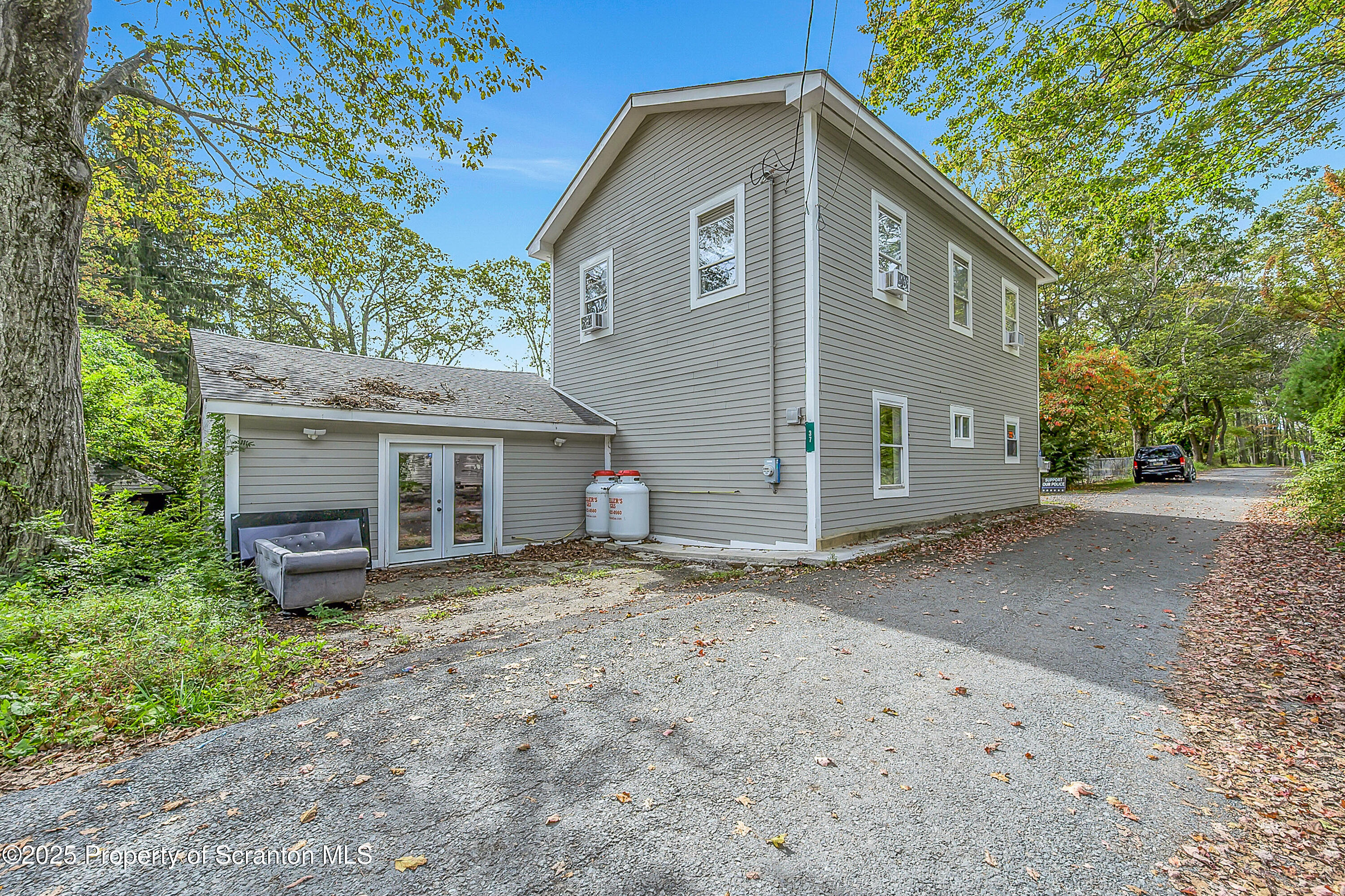 37 Mount Pocono Court Mount Pocono, PA 18344 - Photo 5 of 39 a front view of a house with a yard