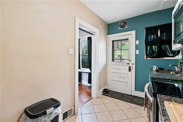 a kitchen with a refrigerator and a stove