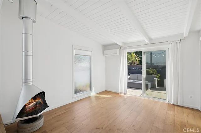 a view of a room with window and wooden floor