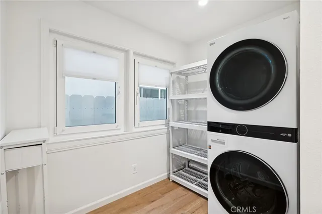a view of a hallway with washer and dryer