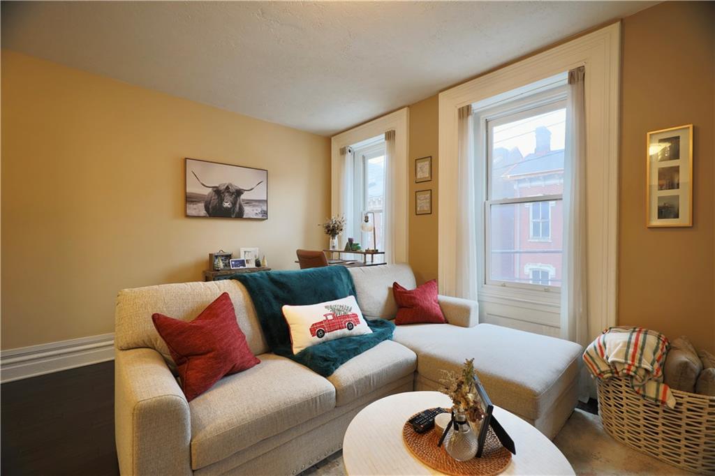 515 Lockhart Street, Unit 3 Pittsburgh, PA 15212 - Photo 12 of 27 a living room with furniture and a window