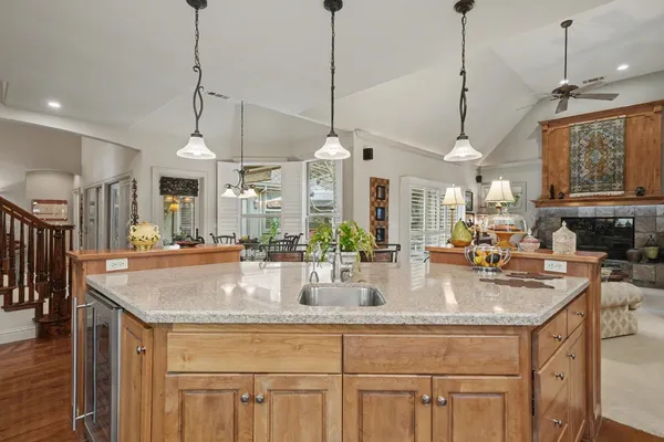 a view of a hallway with wooden floor and entryway