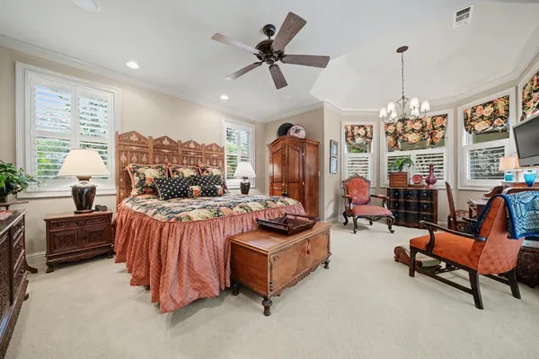 a view of an outdoor dining space with a table and chairs