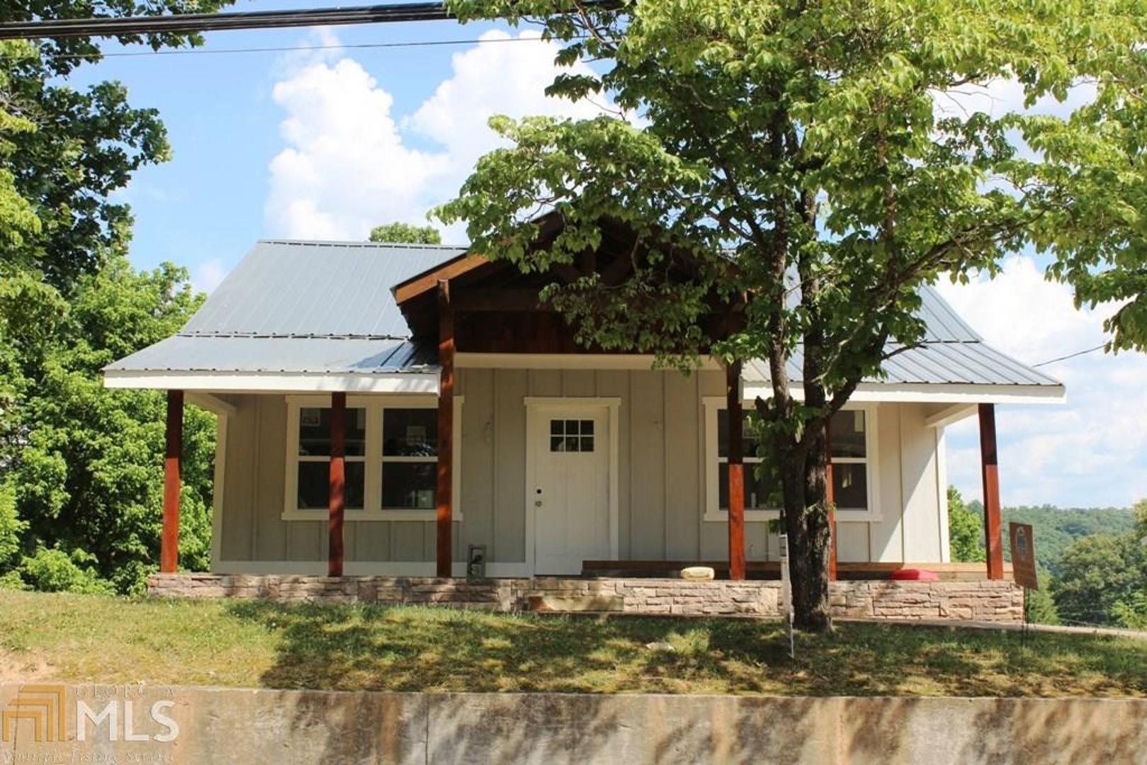 609 East 2nd Street Blue Ridge, GA 30513 - Photo 1 of 1 a front view of a house with garden