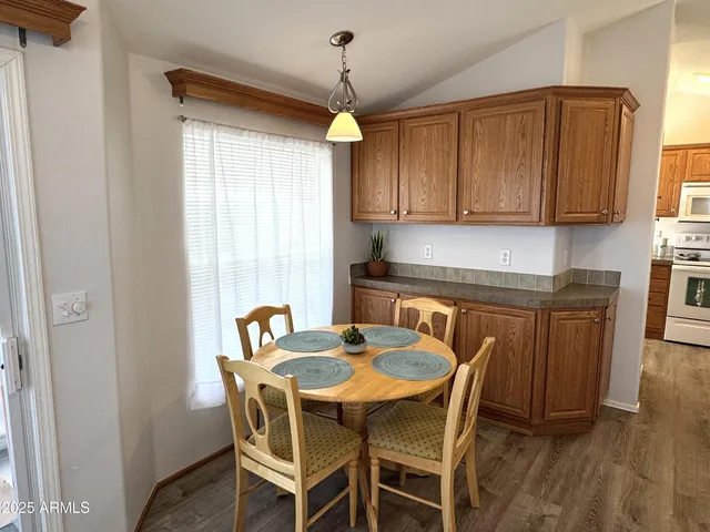 a dining room with furniture and window