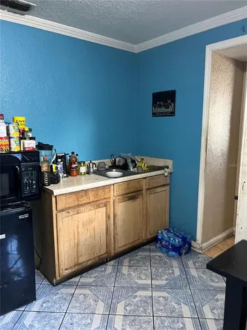 a white refrigerator freezer sitting inside of a kitchen