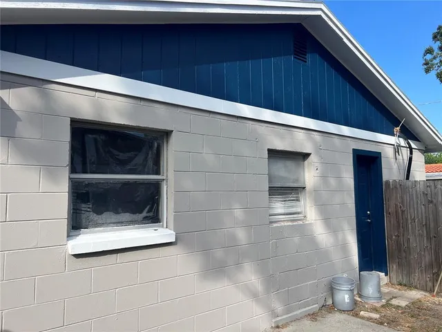 a bathroom with a shower and a sink