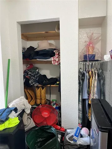 a white toilet sitting next to a shower curtain