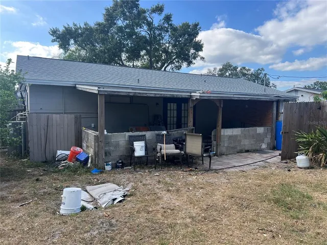a view of a house with a yard and garage