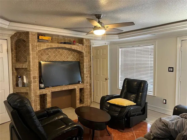 a living room with furniture and a mirror