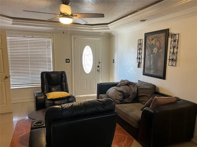 a kitchen with stainless steel appliances kitchen island granite countertop a refrigerator and a stove top oven