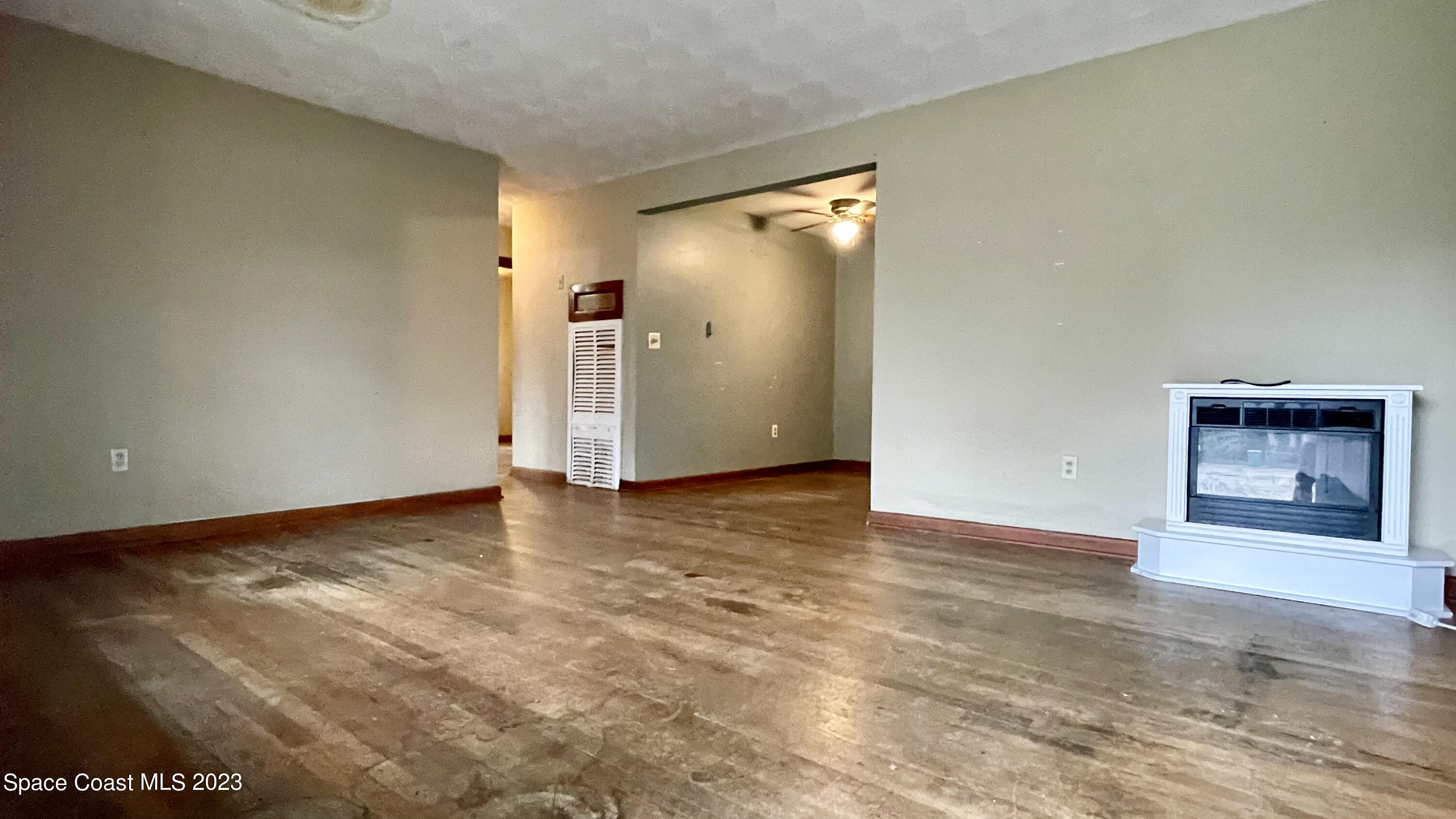 866 Sarno Road Melbourne, FL 32935 - Photo 2 of 19 a view of an empty room and window