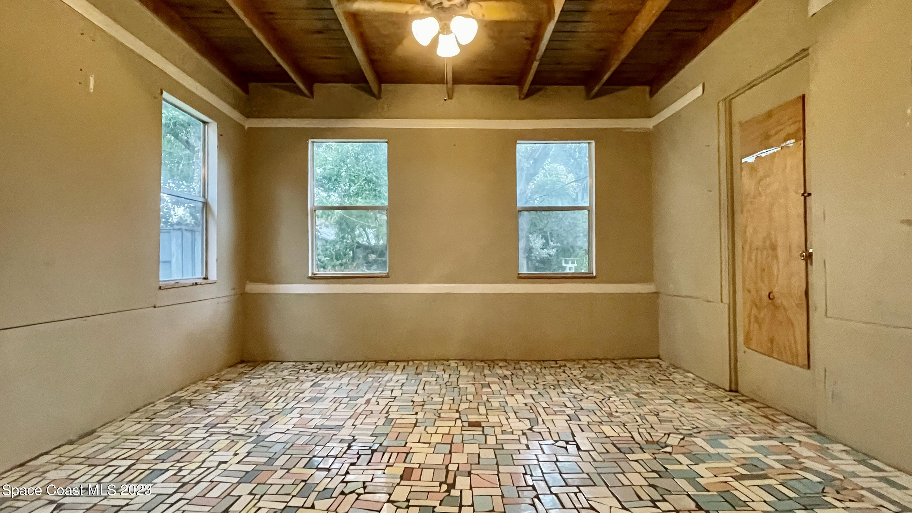 866 Sarno Road Melbourne, FL 32935 - Photo 8 of 19 a view of empty room with a window