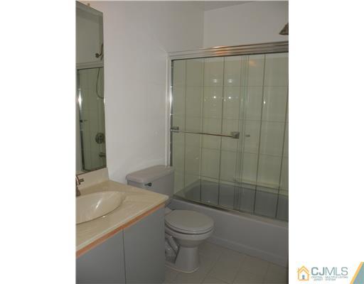 197 Nebula Road Piscataway, NJ 08854 - Photo 14 of 18 a bathroom with a shower a toilet and sink