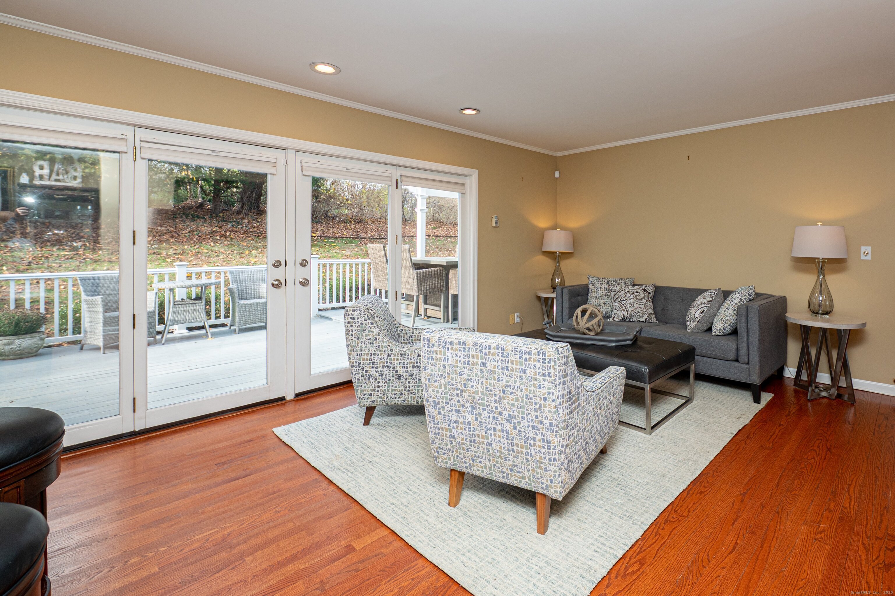 15 Griffing Pond Road Branford, CT 06405 - Photo 16 of 40 a living room with furniture and a large window