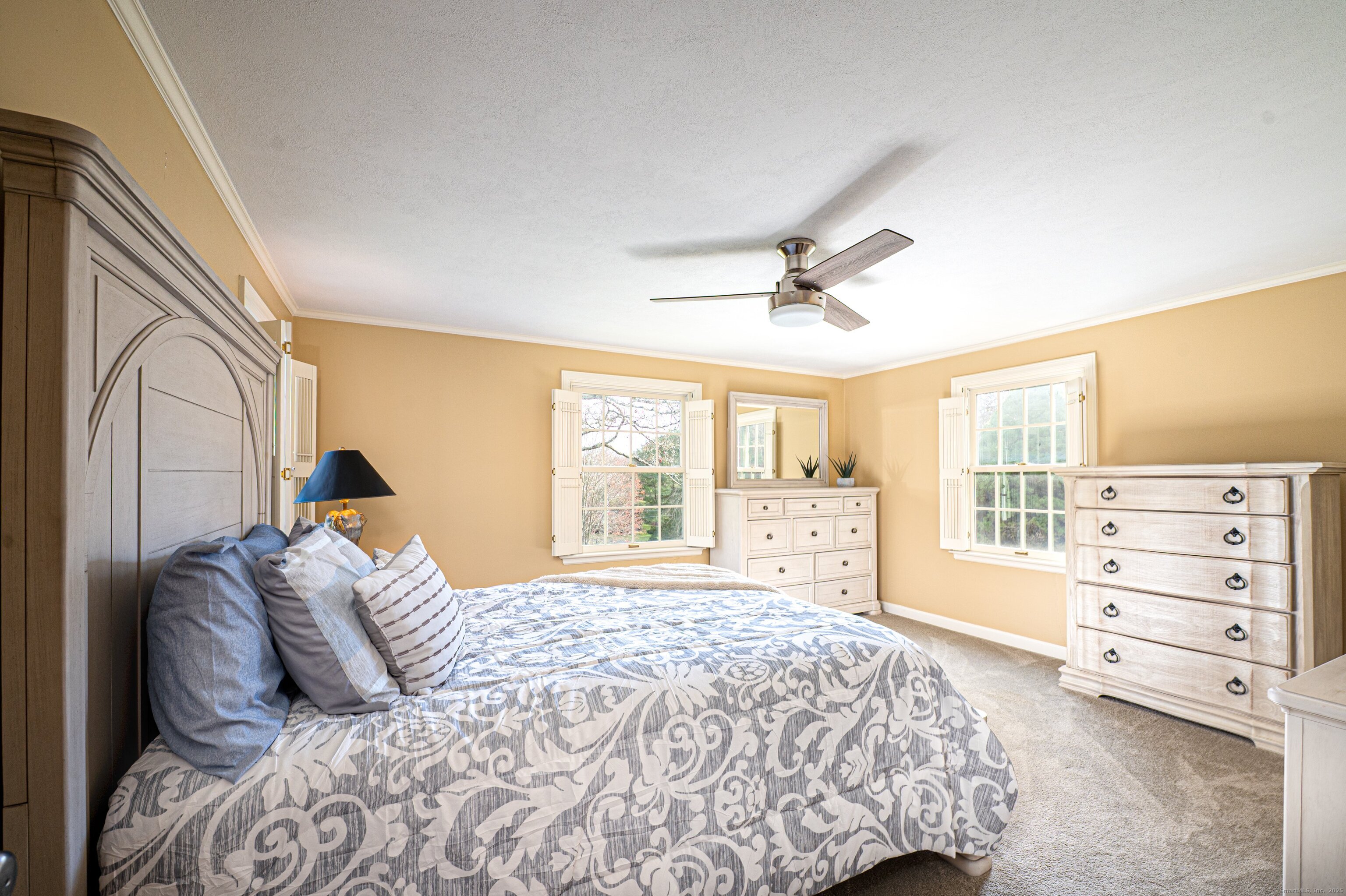 15 Griffing Pond Road Branford, CT 06405 - Photo 26 of 40 a bedroom with a bed and a window