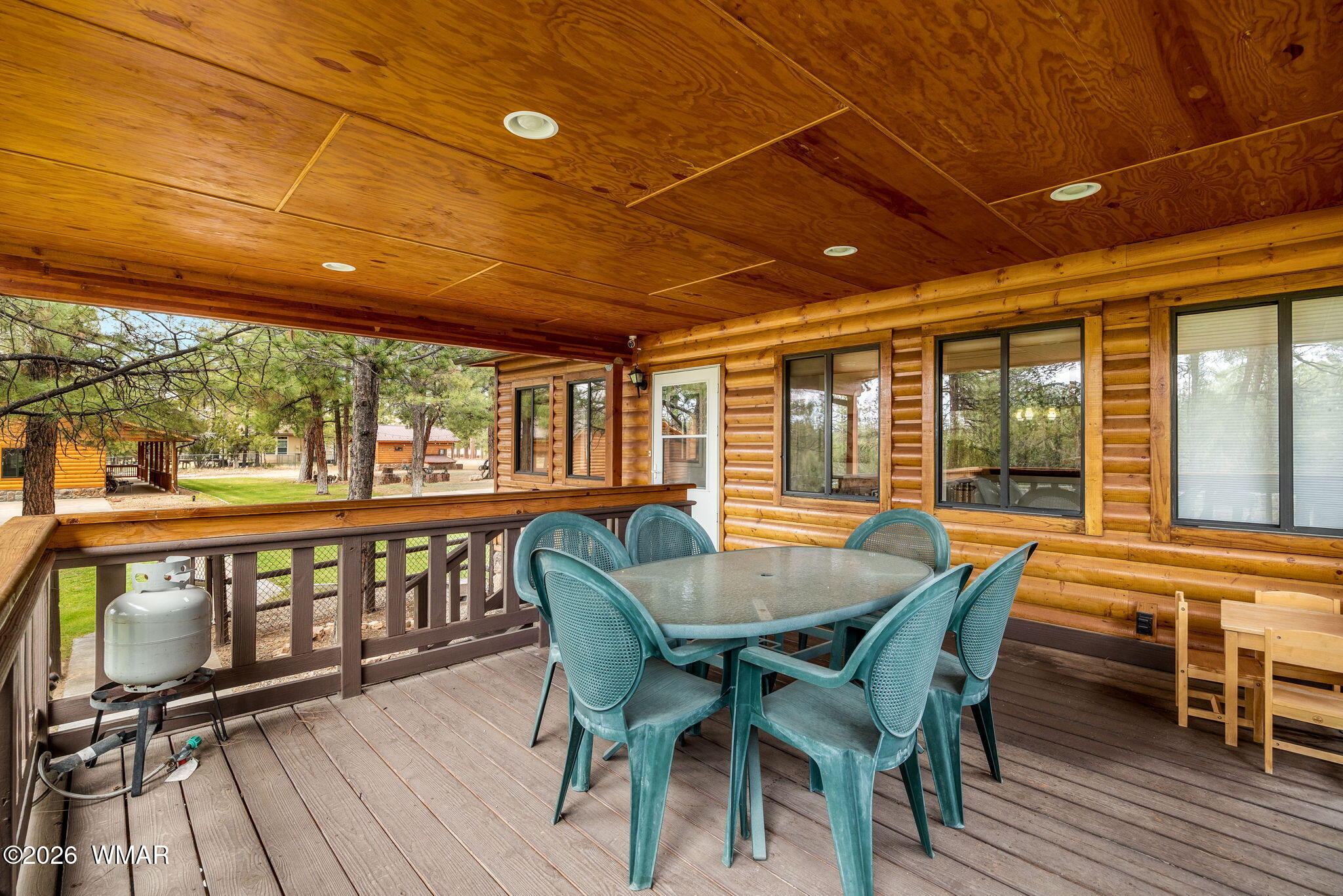 2922 Pine Rim Road Overgaard, AZ 85933 - Photo 41 of 58 a view of a patio with a table and chairs