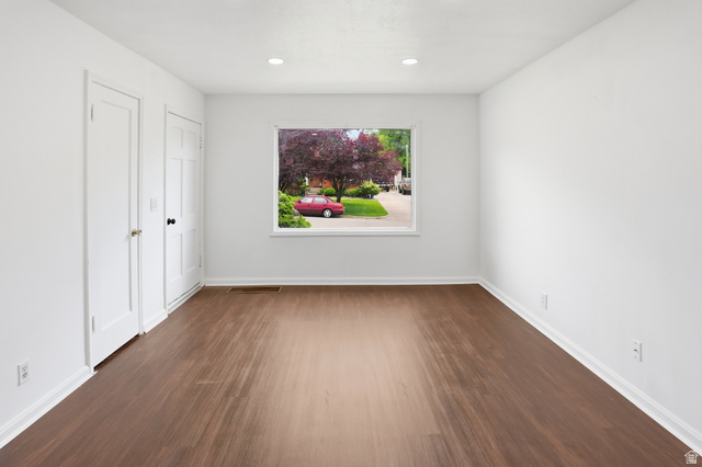 774 37th Street South Ogden, UT 84403 - Photo 12 of 47 Spacious room featuring wood-finish flooring and bright white walls