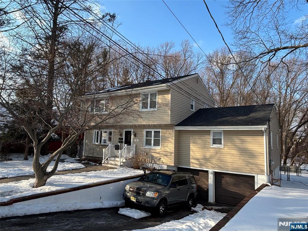 47 Cooper Street Bergenfield, NJ 07621 - Photo 2 of 12 a front view of a house with porch
