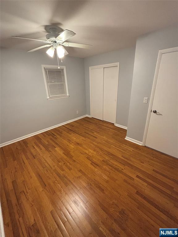47 Cooper Street Bergenfield, NJ 07621 - Photo 9 of 12 a view of an empty room with wooden floor and a window