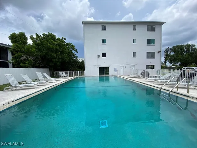 a view of pool with seating space