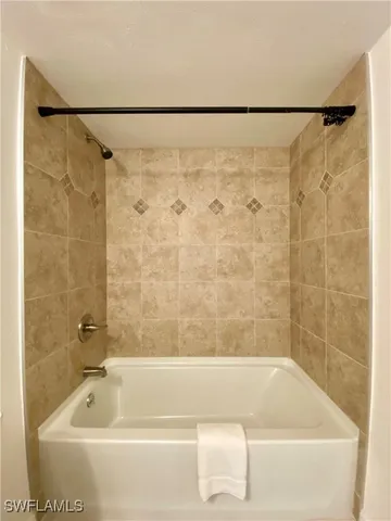 a bathroom with a shower and a bathtub