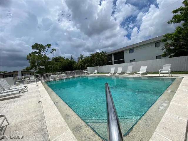a view of a backyard with sitting area