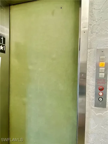 a bathroom with a shower and a table