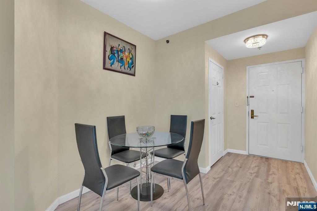 100 Old Palisade Road, Unit 3101 Fort Lee, NJ 07024 - Photo 12 of 28 a view of a workspace with furniture and wooden floor