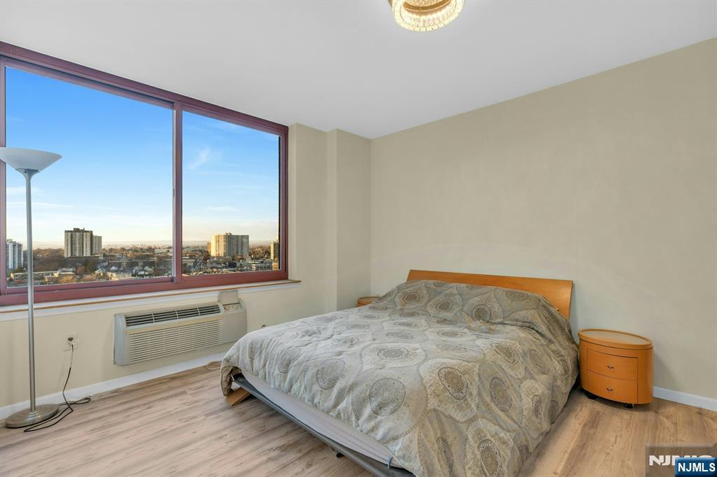 100 Old Palisade Road, Unit 3101 Fort Lee, NJ 07024 - Photo 16 of 28 a bedroom with a bed and a window