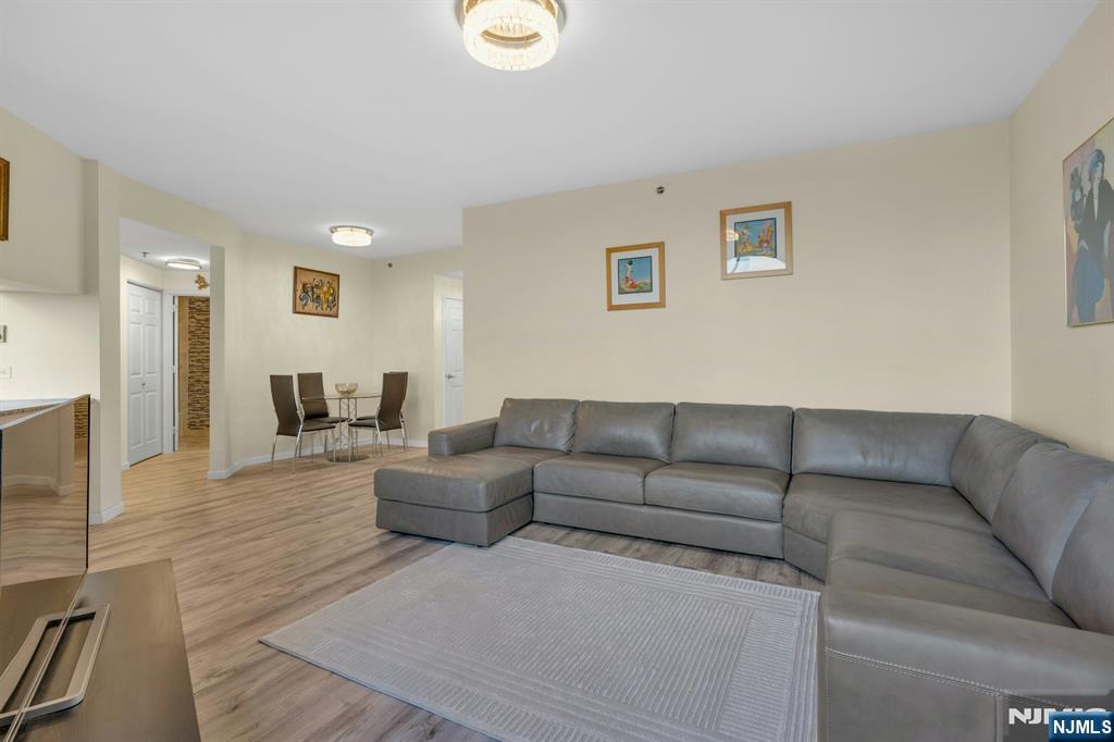 100 Old Palisade Road, Unit 3101 Fort Lee, NJ 07024 - Photo 3 of 28 a living room with furniture and a couch