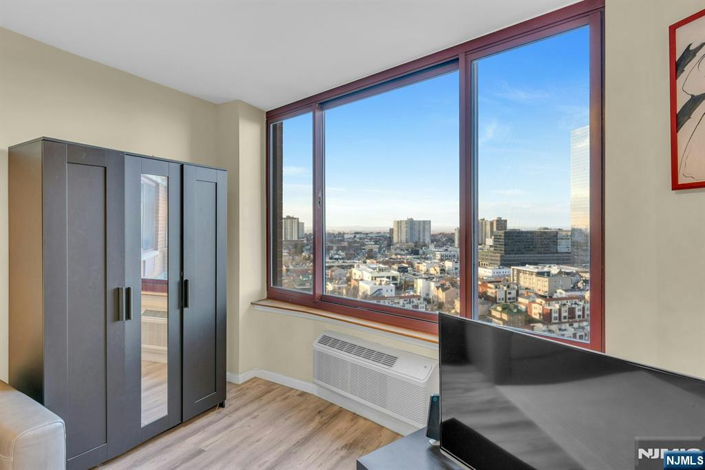 100 Old Palisade Road, Unit 3101 Fort Lee, NJ 07024 - Photo 5 of 28 a view of a room with wooden floor and windows