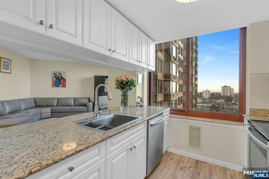 100 Old Palisade Road, Unit 3101 Fort Lee, NJ 07024 - Photo 10 of 28 a kitchen with sink and cabinets