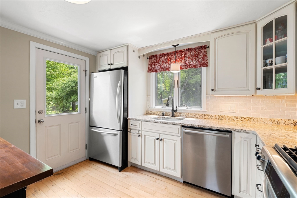 35 Spallus Road Stoughton, MA 02072 - Photo 18 of 39 a kitchen with stainless steel appliances granite countertop a refrigerator sink and cabinets