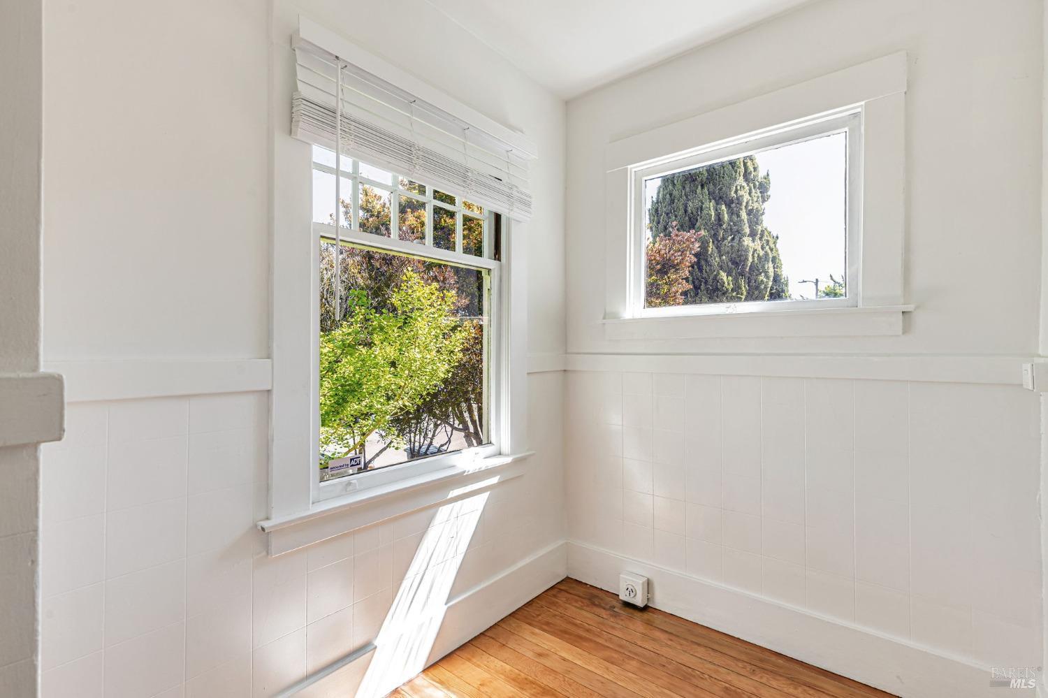 1528 Sutter Street Vallejo, CA 94590 - Photo 23 of 33 a view of an empty room with wooden floor and a window