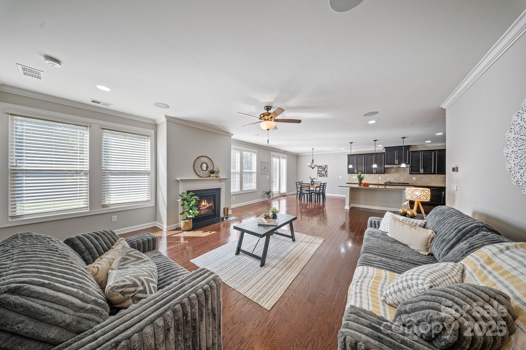 1433 Cilantro Court Tega Cay, SC 29708 - Photo 12 of 42 a living room with furniture and a fireplace