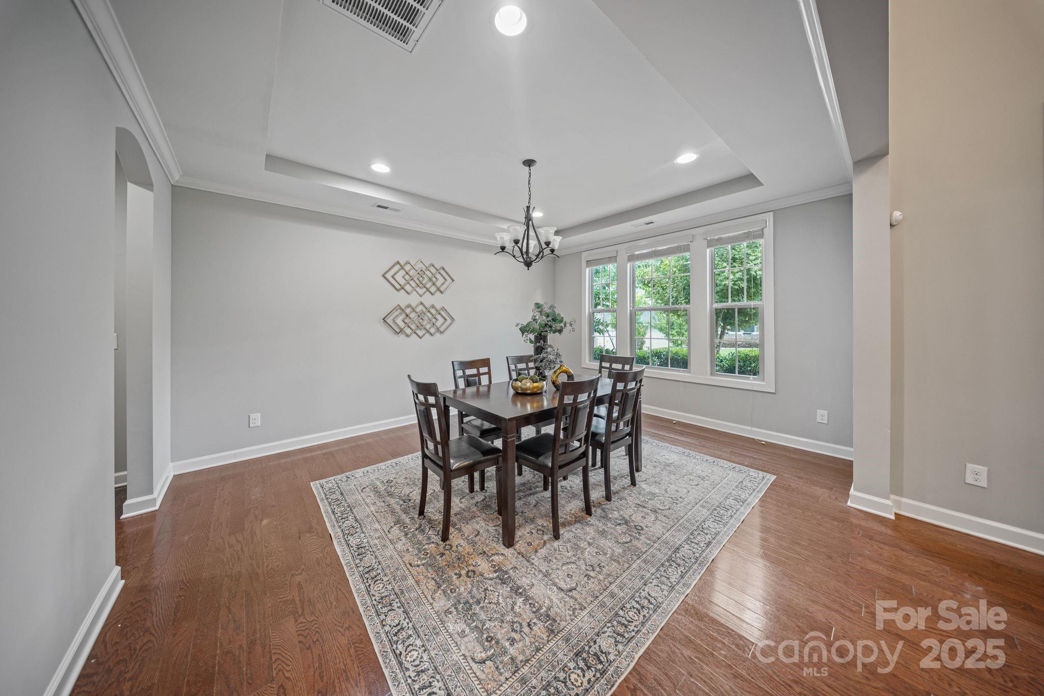 1433 Cilantro Court Tega Cay, SC 29708 - Photo 14 of 42 a view of a dining room with furniture window and outside view