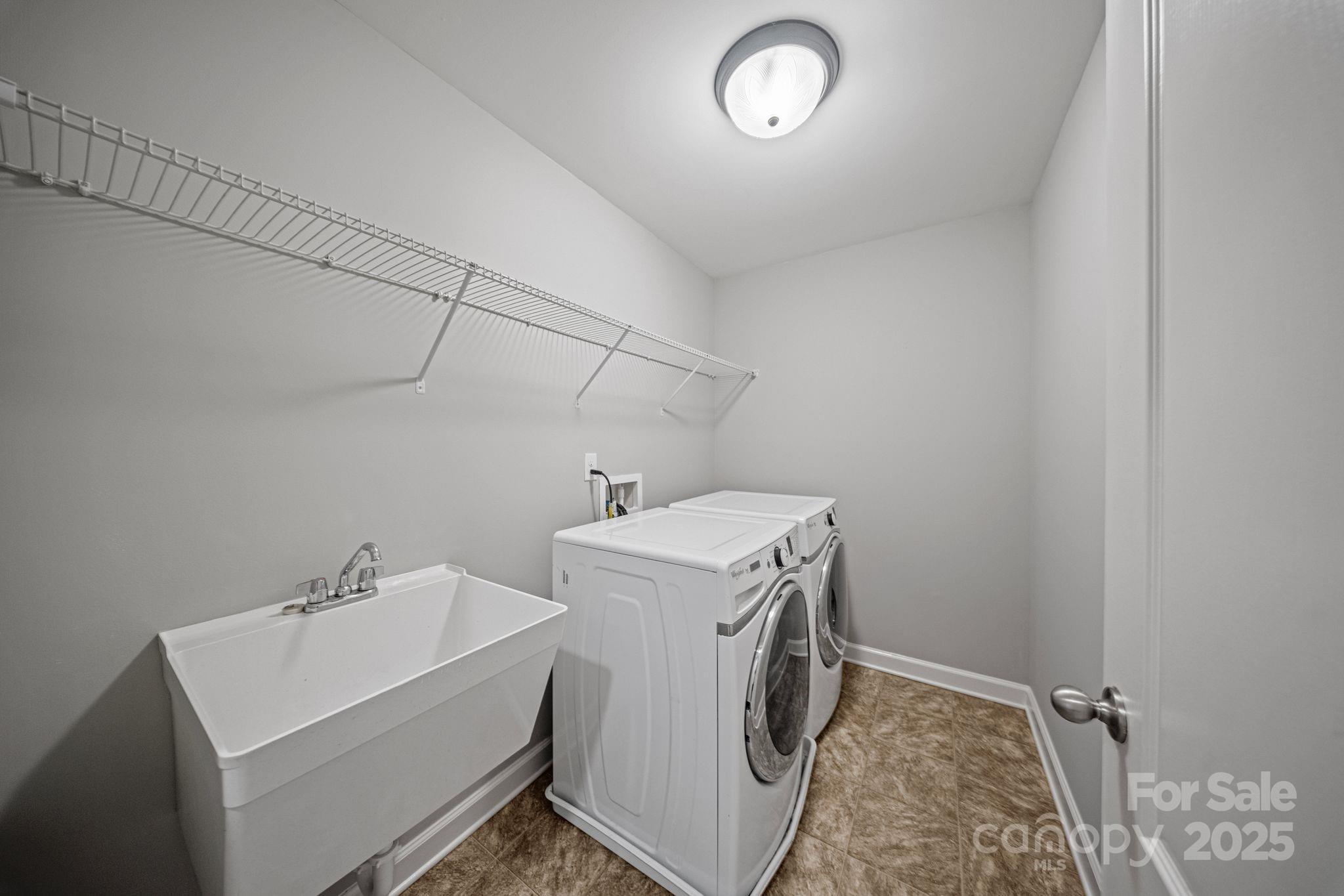 1433 Cilantro Court Tega Cay, SC 29708 - Photo 31 of 42 a utility room with dryer and washer