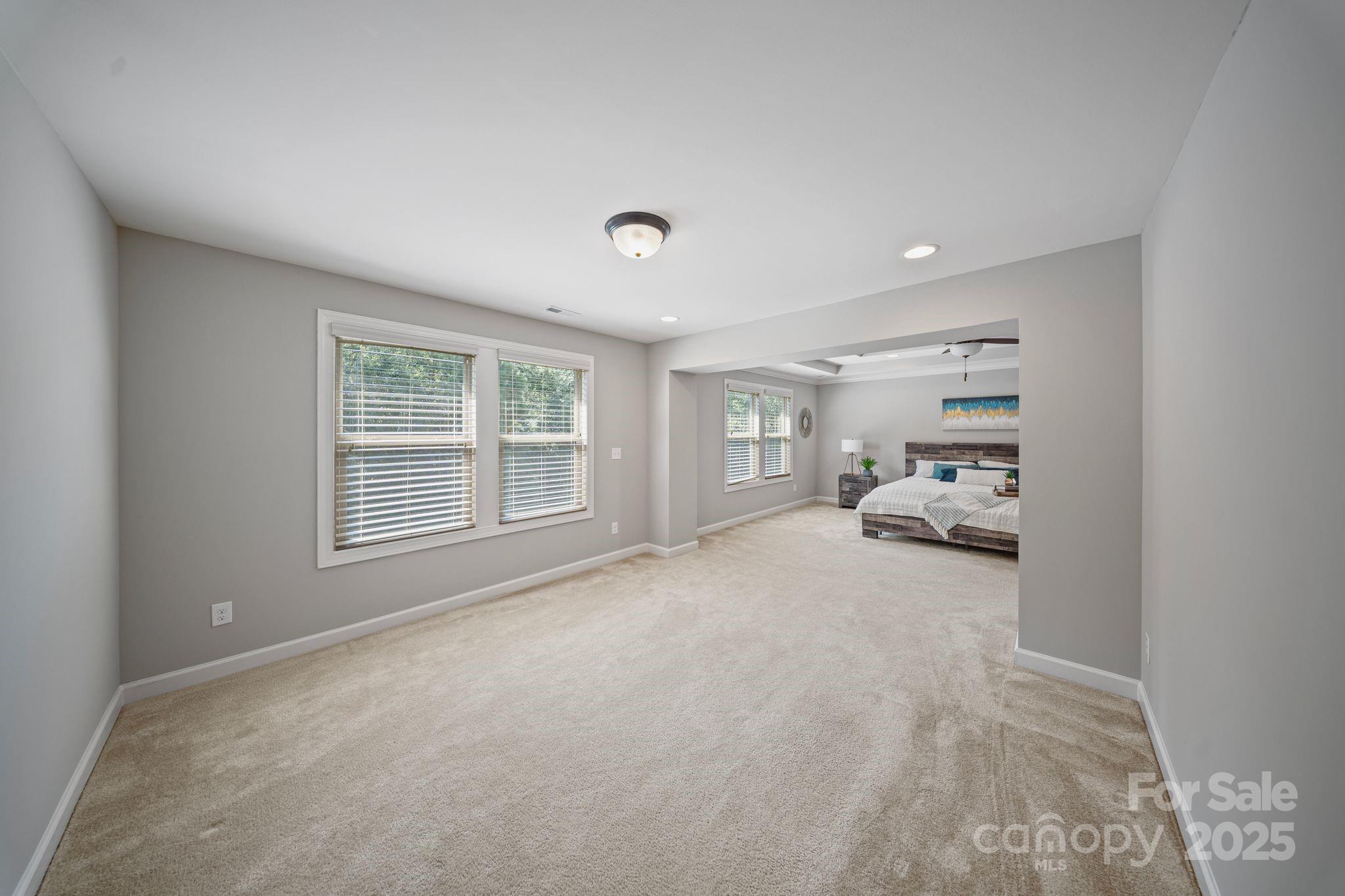 1433 Cilantro Court Tega Cay, SC 29708 - Photo 36 of 42 a view of livingroom with furniture and window