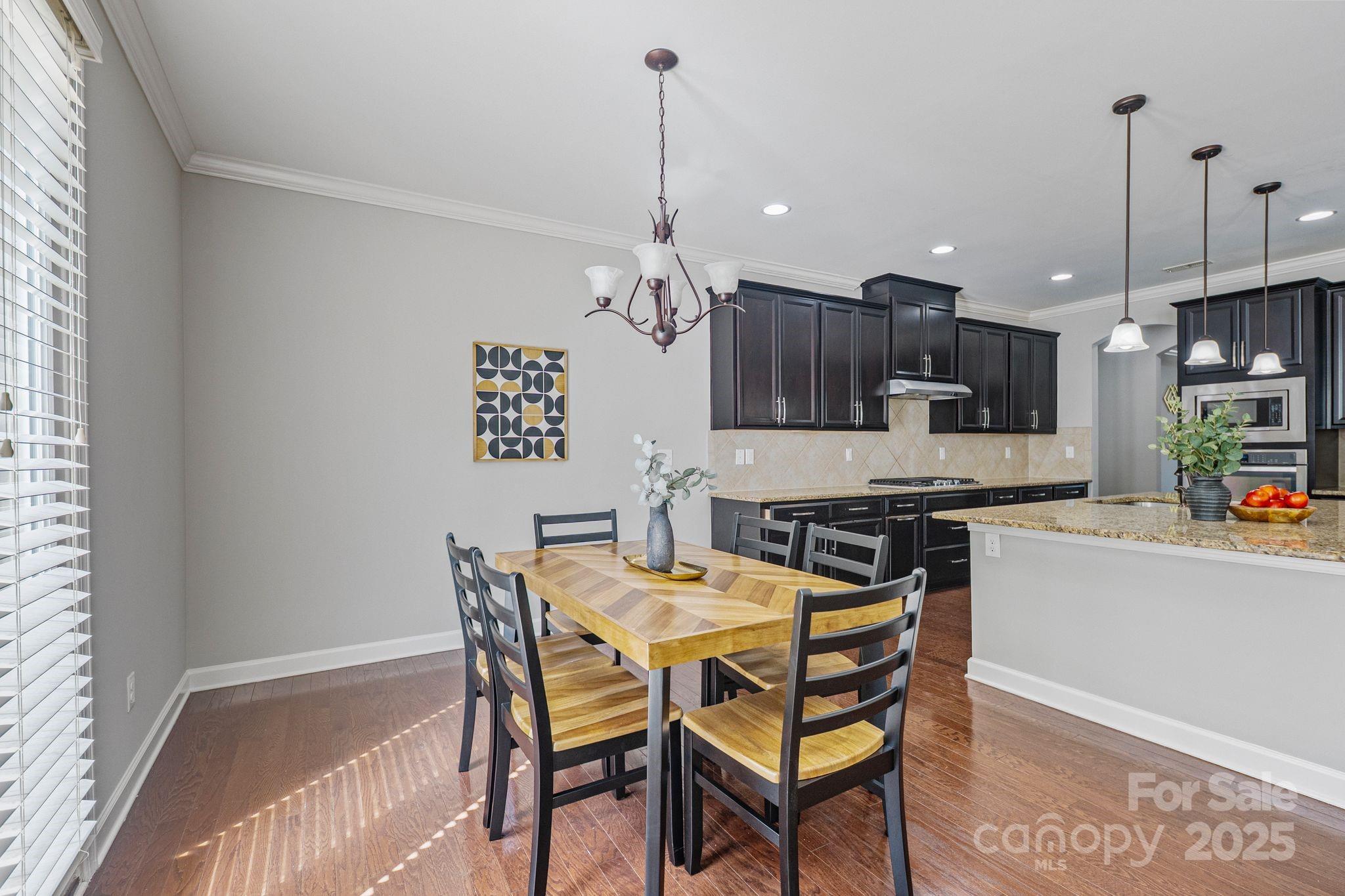1433 Cilantro Court Tega Cay, SC 29708 - Photo 7 of 42 a view of a dining room with furniture