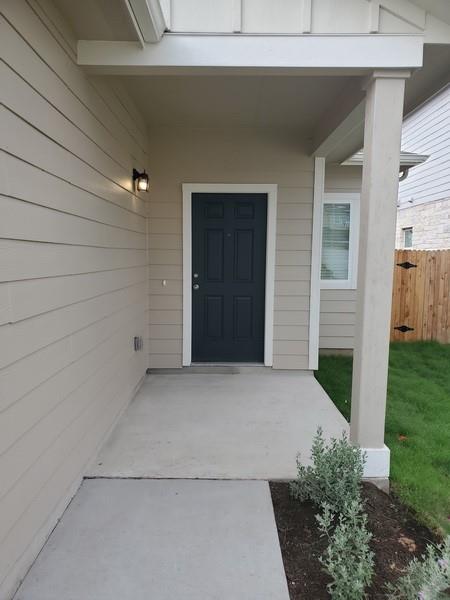 6404 Gunflint Drive Austin, TX 78747 - Photo 3 of 21 A welcoming covered porch with sleek siding creates inviting curb appeal.