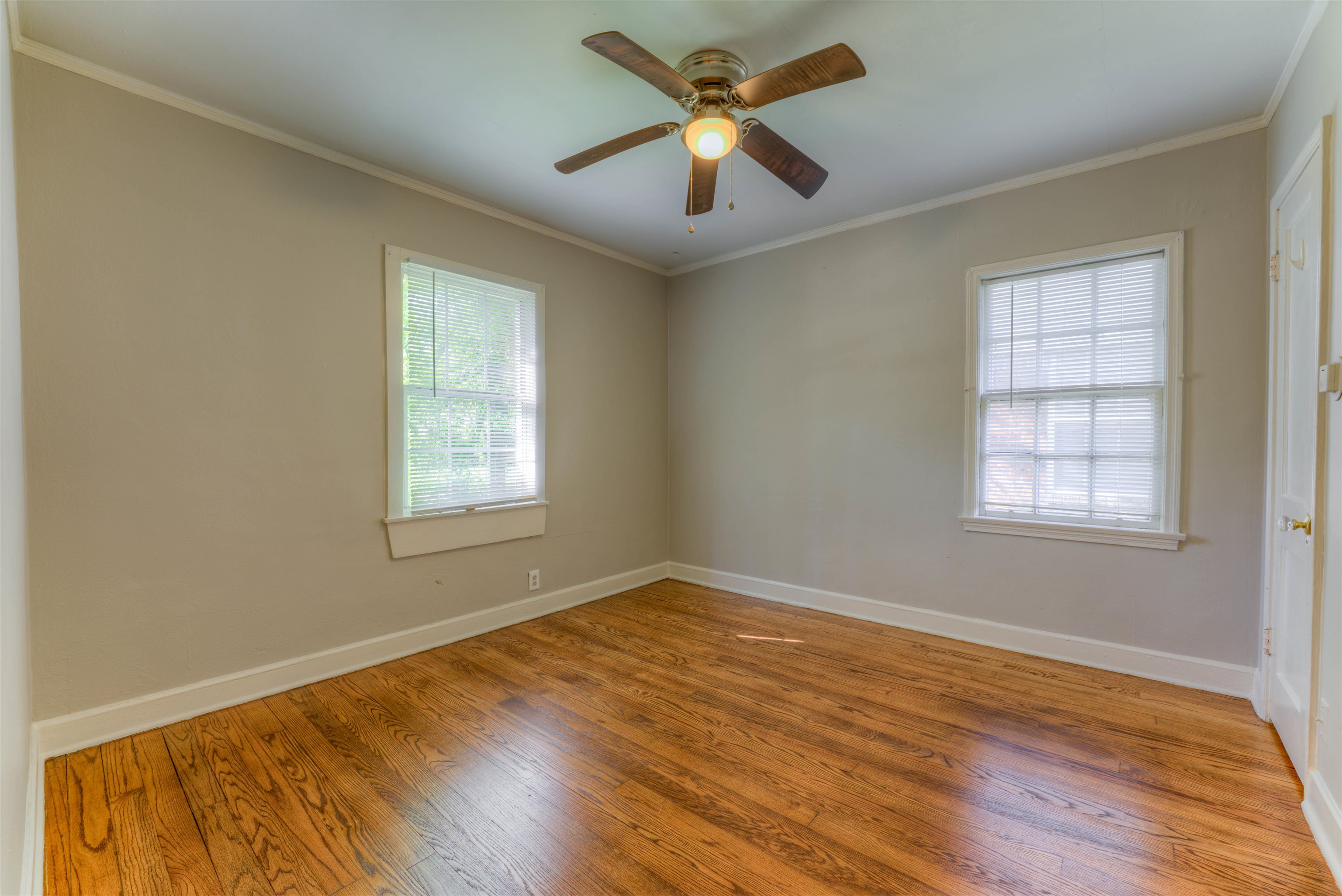 777 Loeb Street Memphis, TN 38111 - Photo 18 of 22 a view of empty room with wooden floor and fan