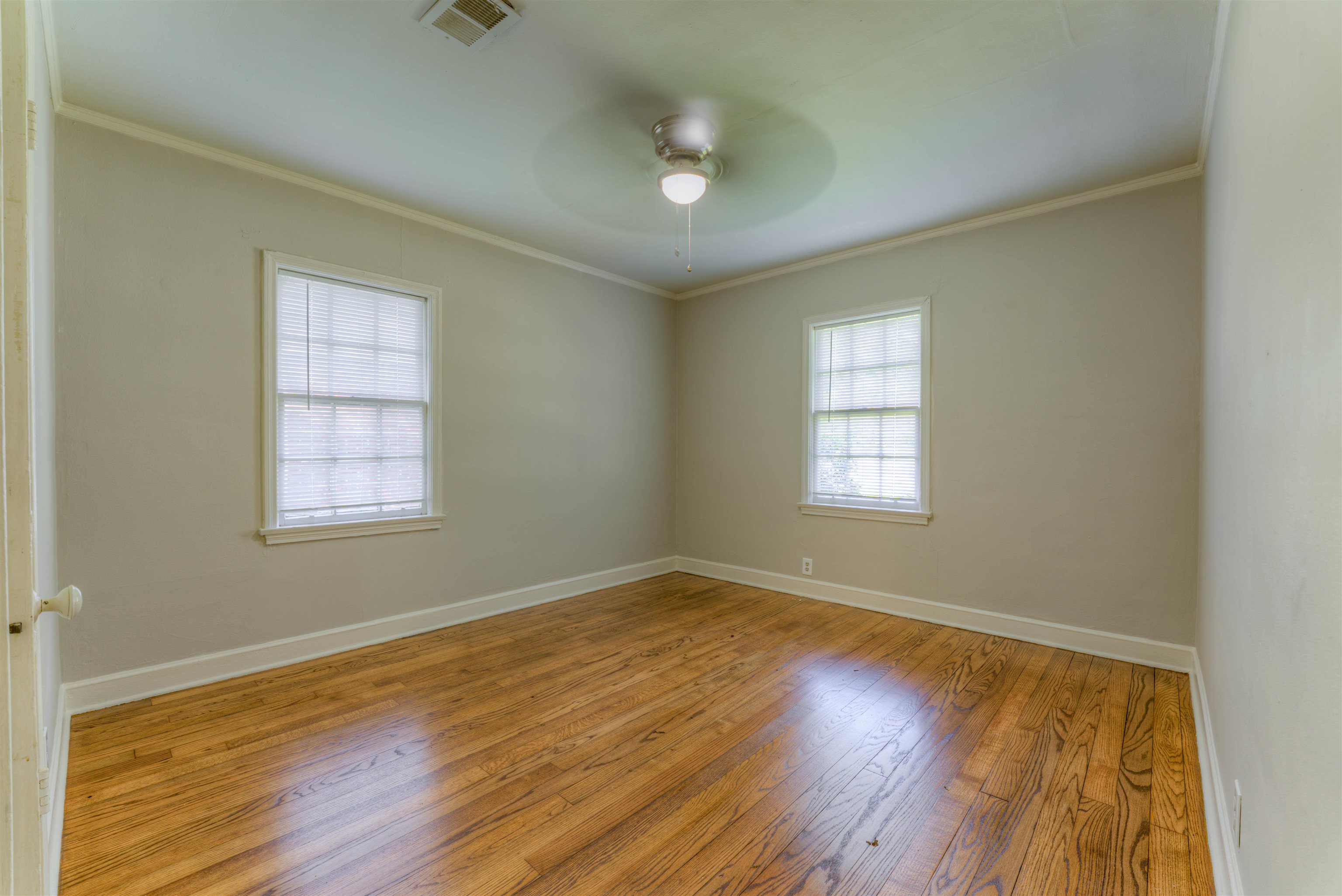 777 Loeb Street Memphis, TN 38111 - Photo 19 of 22 a view of an empty room with wooden floor and a window