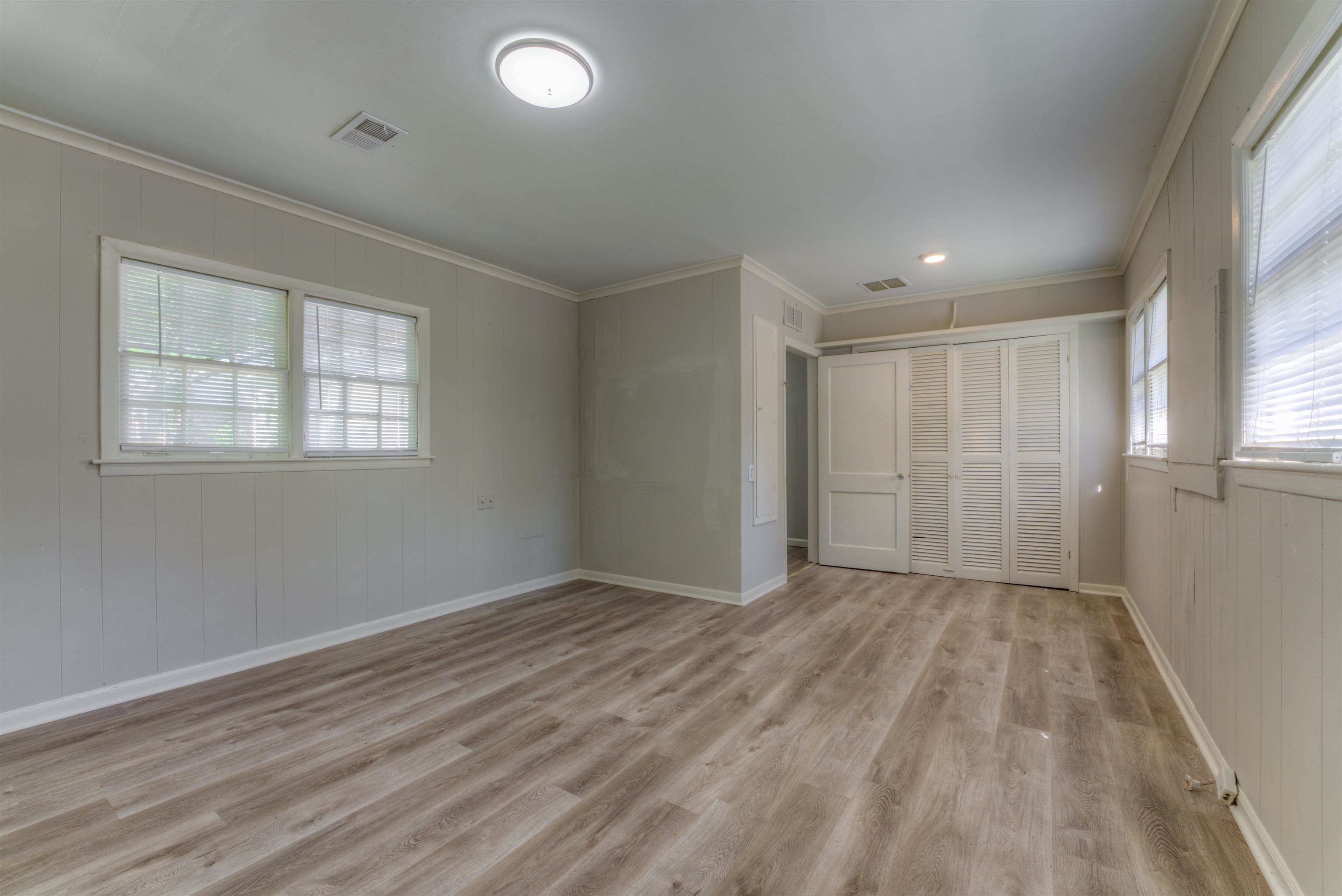 777 Loeb Street Memphis, TN 38111 - Photo 21 of 22 an empty room with wooden floor and windows