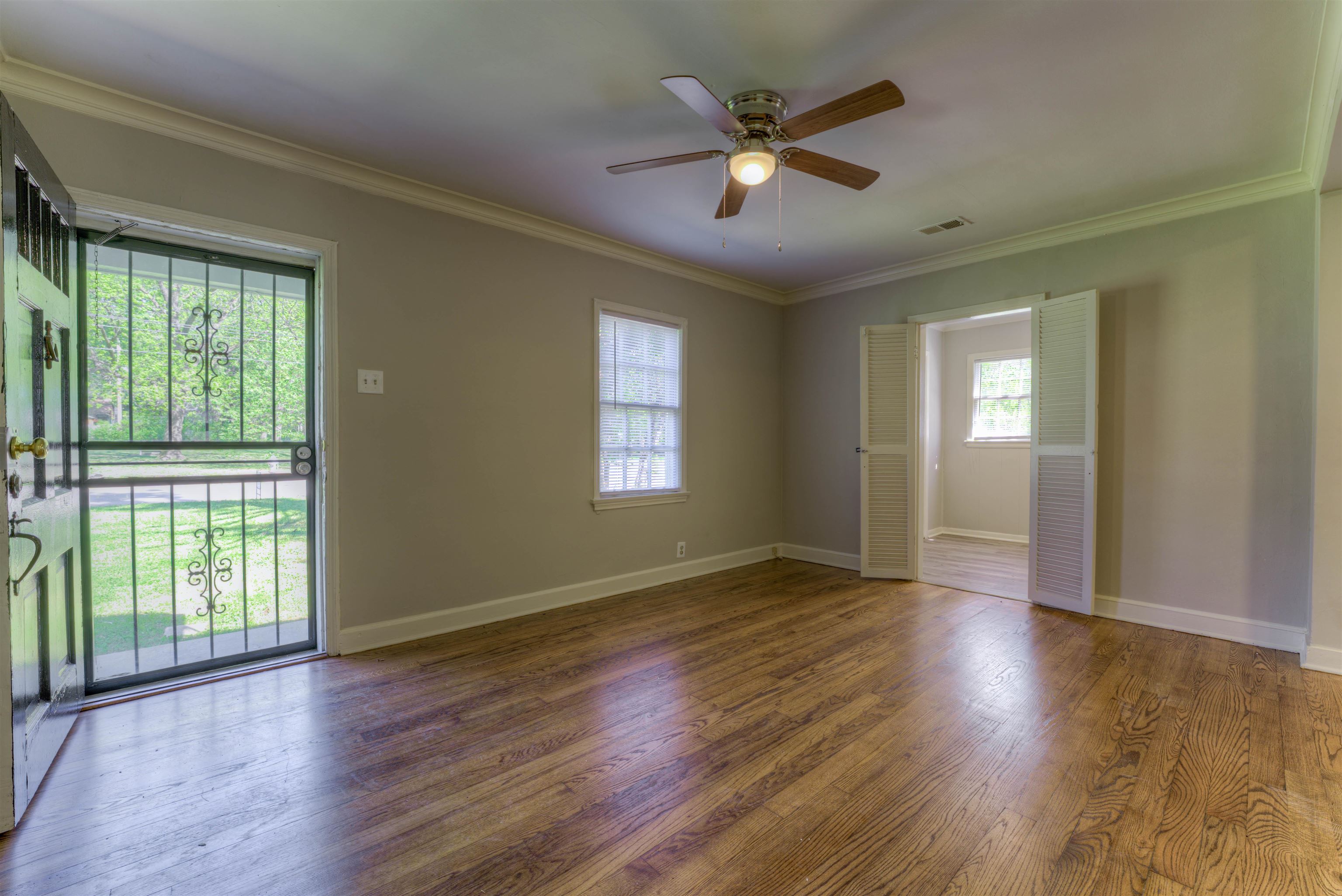 777 Loeb Street Memphis, TN 38111 - Photo 10 of 22 a view of an empty room with wooden floor and a window
